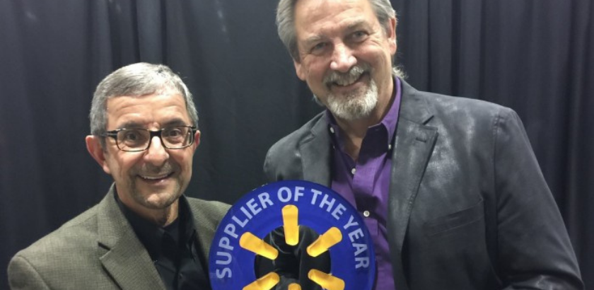 photo of two men holding an award