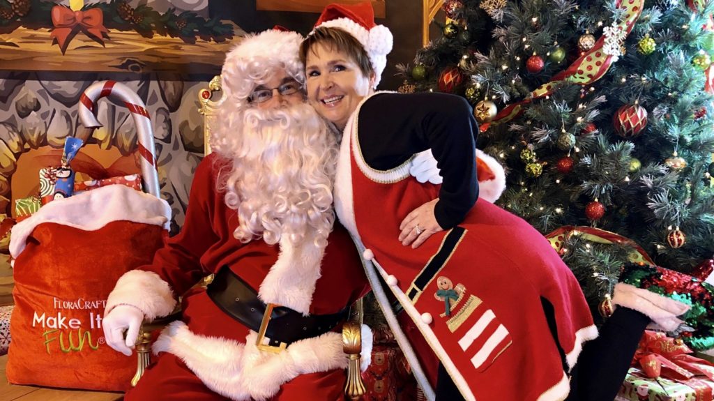 Santa and his helper prepare for kids to visit