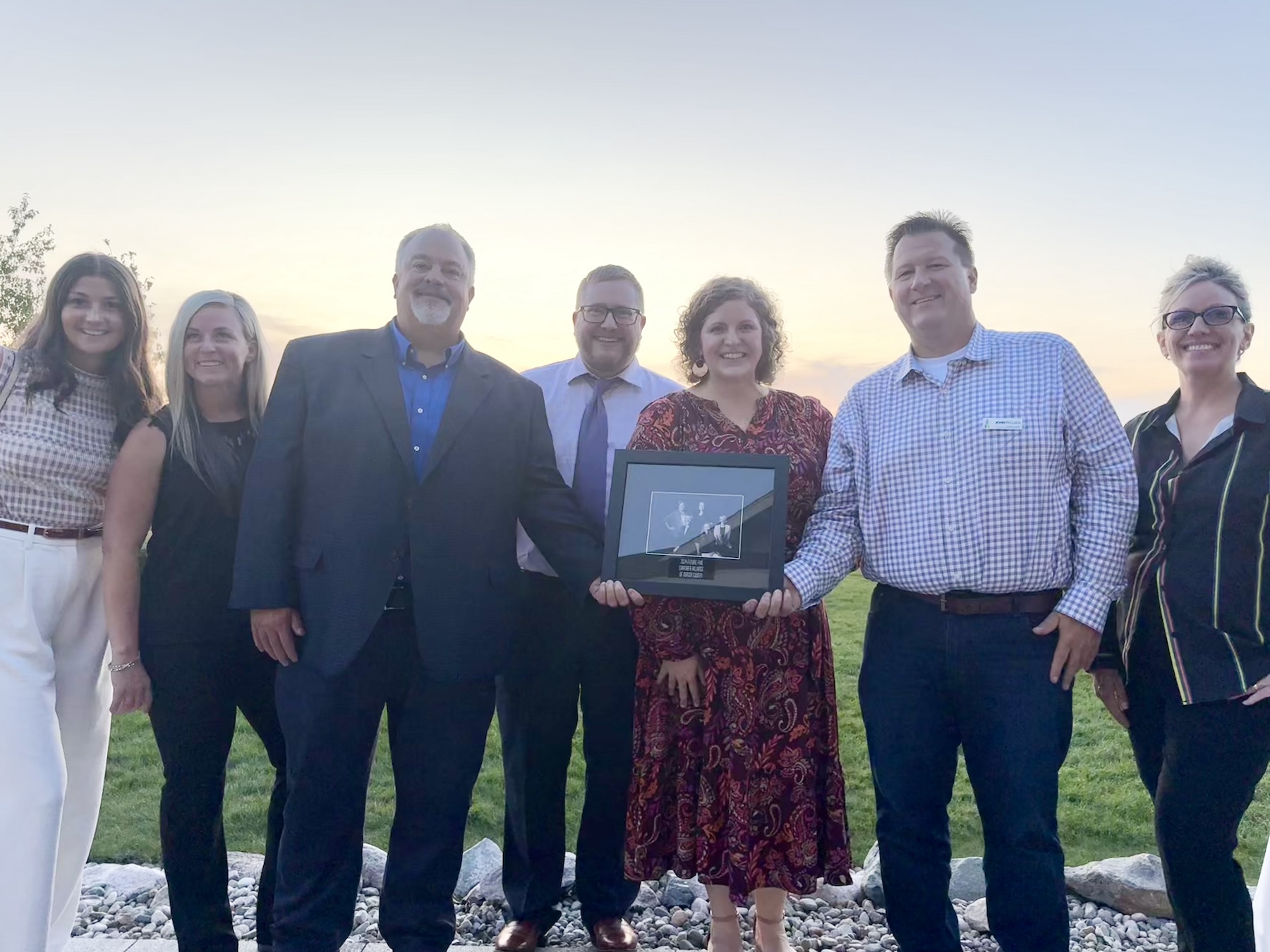 Jamie Sutton, center, is joined by FloraCraft team members to celebrate her inclusion on the Mason County Alliance Chamber Future Give.